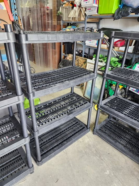 Three Black Plastic Adjustable Shelving Racks