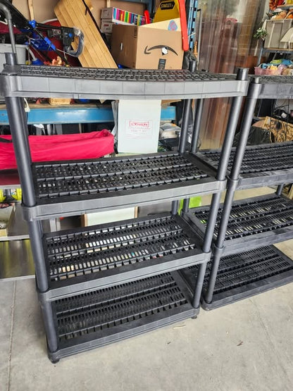 Three Black Plastic Adjustable Shelving Racks