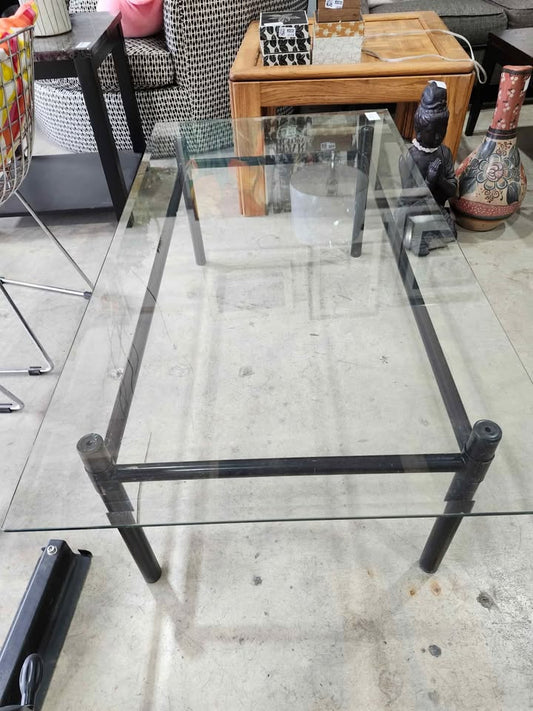 Glass top coffee table with black metal frame