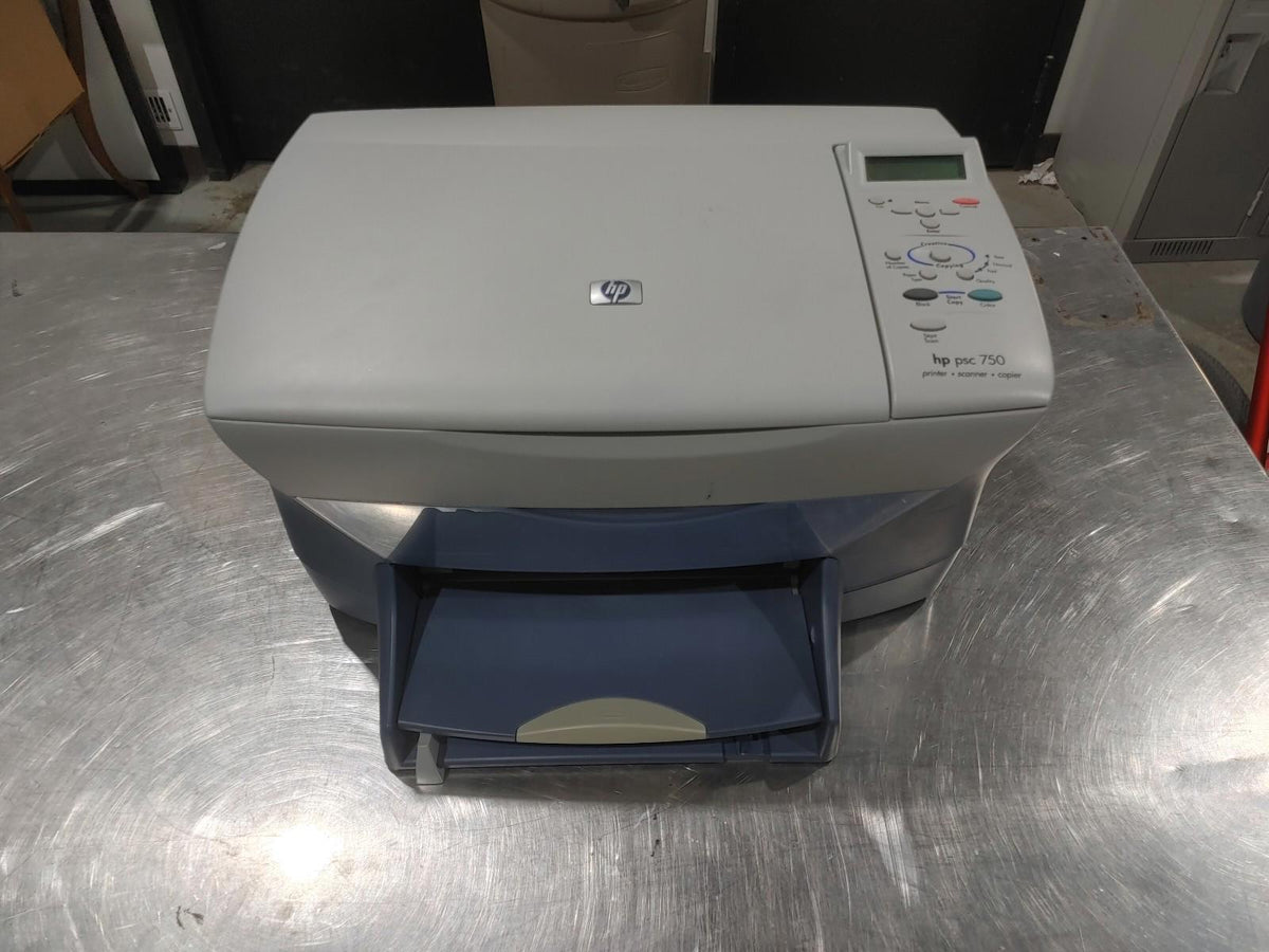 Bon état, imprimante multifonction HP PSC 750 grise, testée et fonctionnelle. Cartouches d’encre à remplacer.