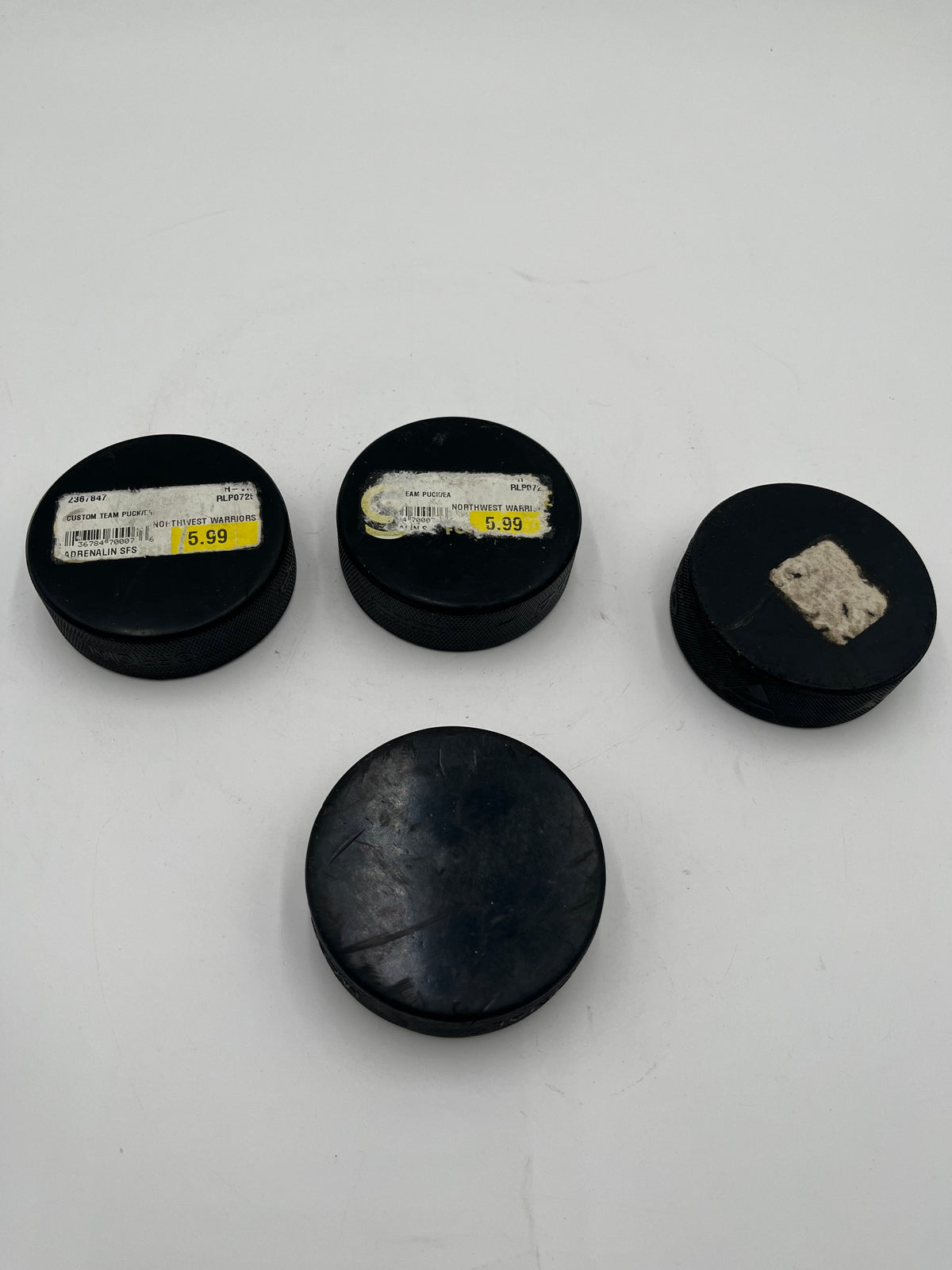 Lot of 4 Hockey Pucks – Northwest Warriors Custom & Source for Sports