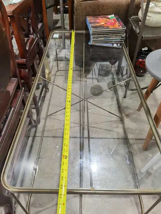 Glass top, metal frame coffee table