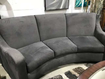 Curving grey sofa