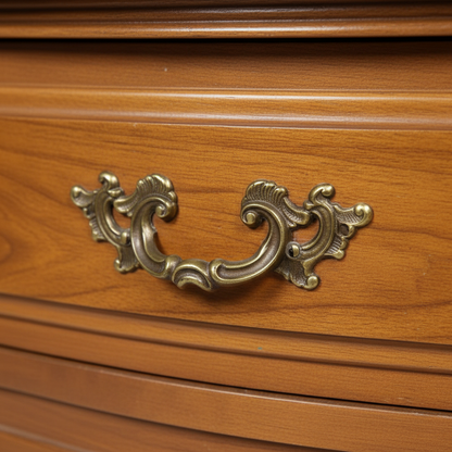 Close-up of the ornate brass drawer pull