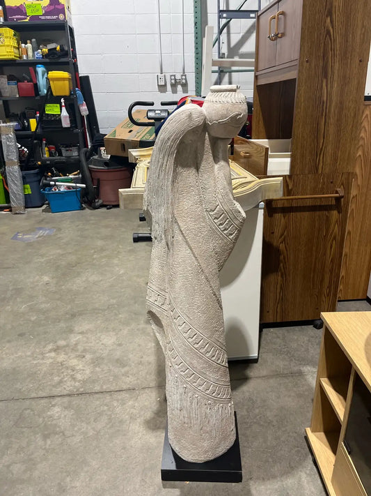 Statue of the woman with a pitcher