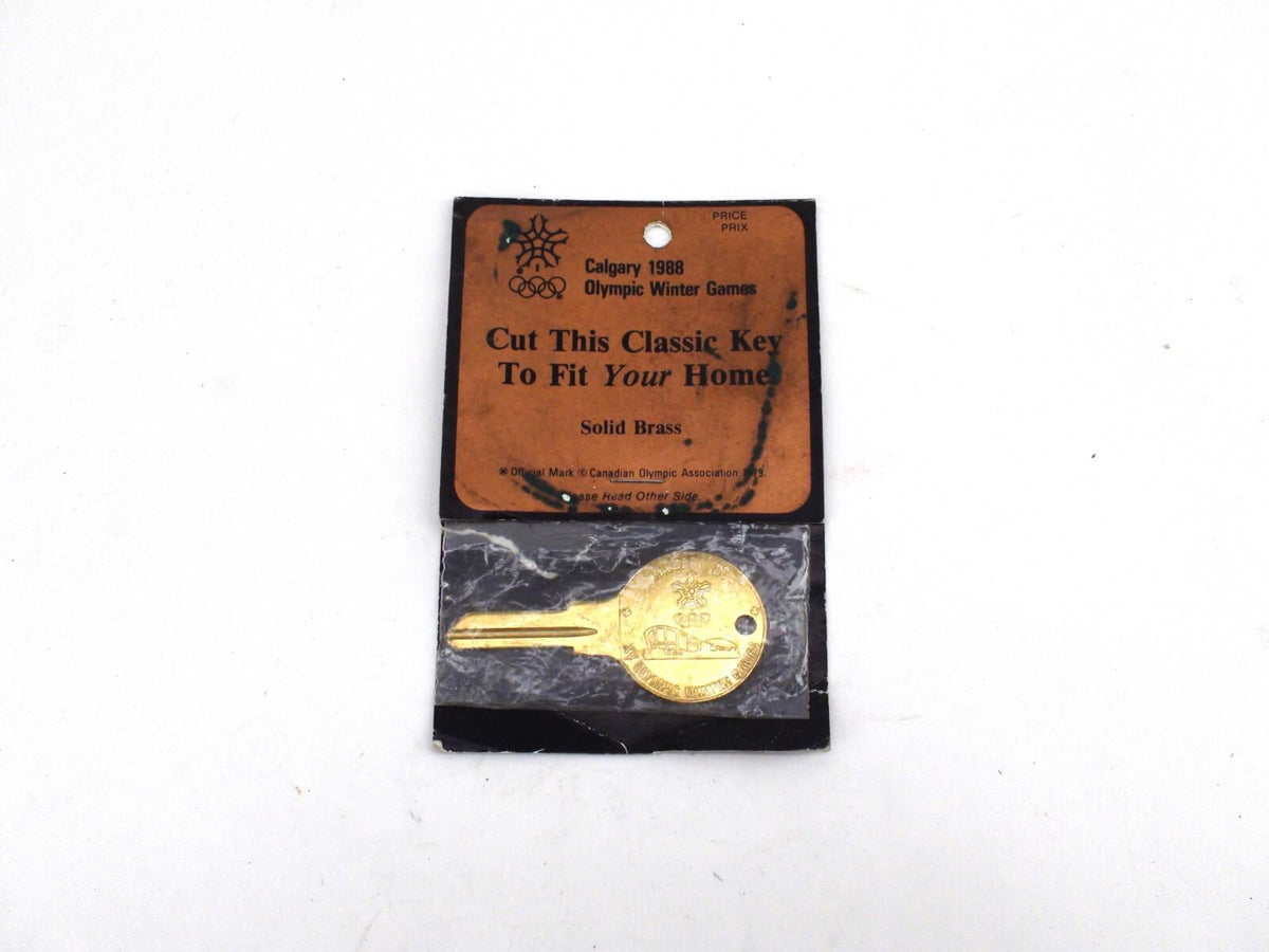 Porte-clés souvenir des Jeux olympiques d'hiver de Calgary 88, non découpé, dans un emballage endommagé - Laiton
