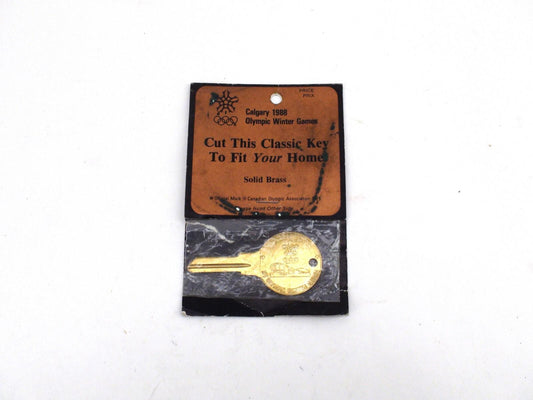 '88 Calgary Winter Olympic Souvenir Key, Uncut In Damaged Packaging - Brass