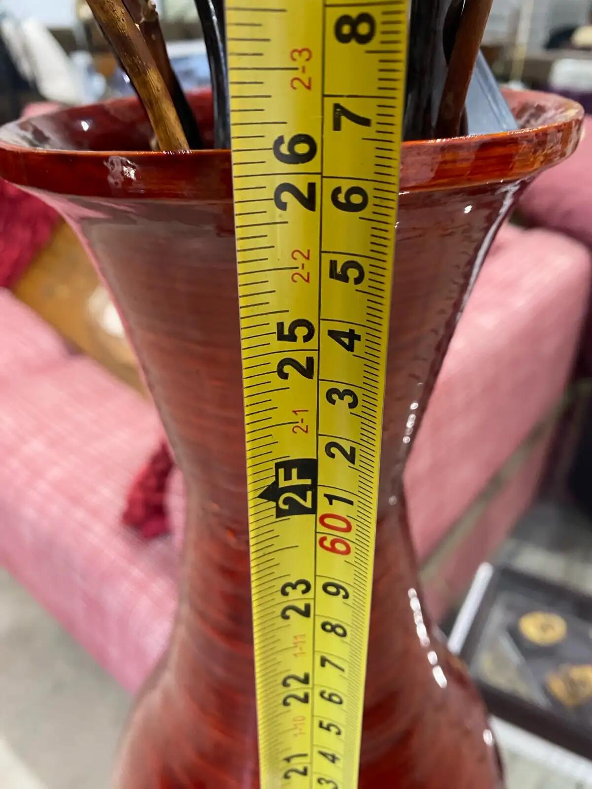 Red Vase with Decorative Twigs